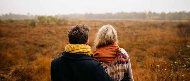 Couple where man with same-sex attraction staring off in the distance.