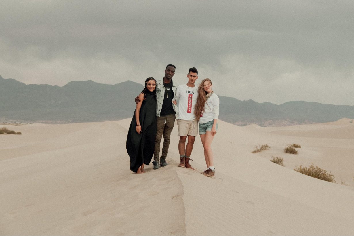 Jon Aragon, Quina Aragon, Juan Garcia, and Haylee Garcia standing in the desert. 