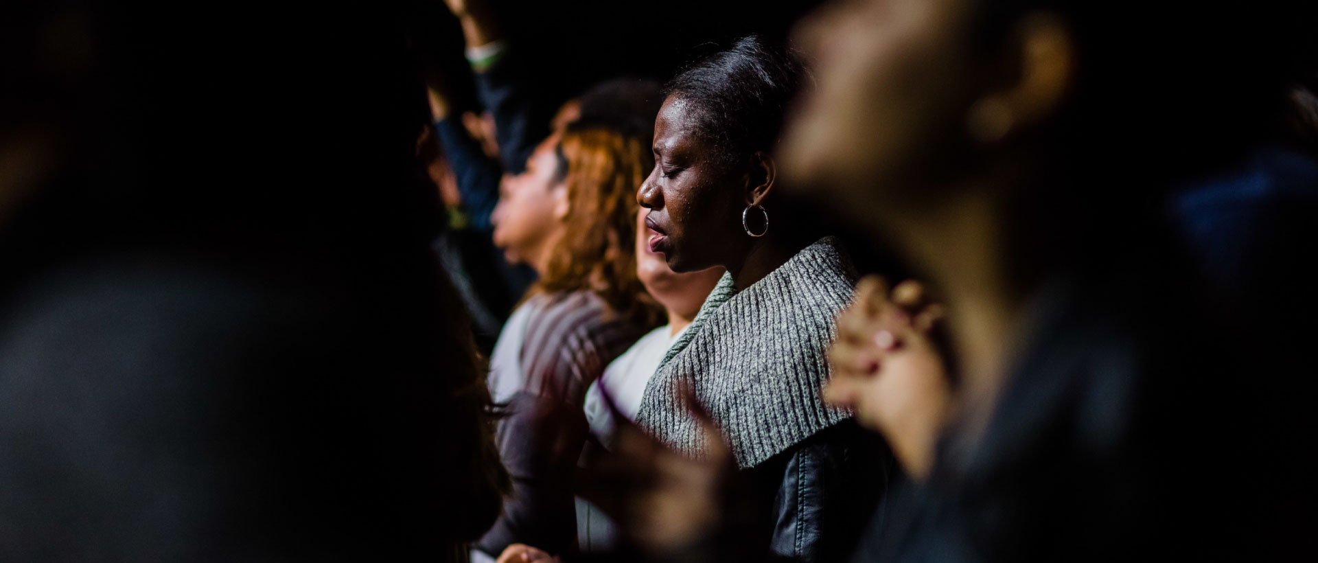 family praying in church