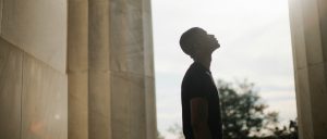 Man looking up at the sky