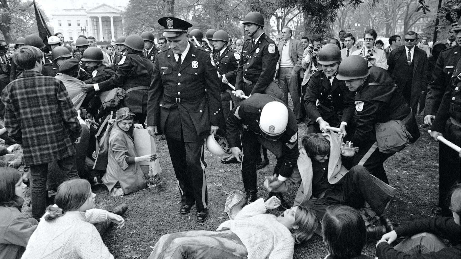 students and police clashing during protests in Lafayette Park in shadow of the white house in 1968