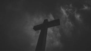 Cross under stormy skies