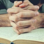 man with open Bible