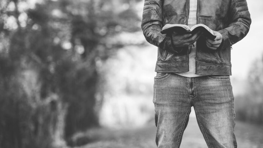 young man holding Bible