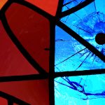 Evangelism Threatened imagery: Stained Glass panel with bullet hole