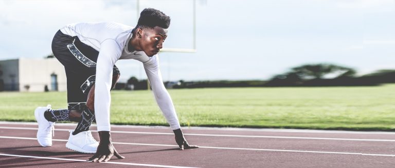 Ambitious man - ready to start a race on a track