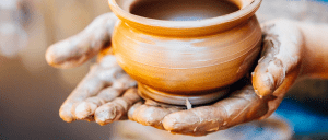 Leadership an antidote to chaos image - hands forming clay pot