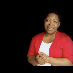 Dudu on black background talking about God's faithfulness in her total life change