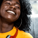 Woman in car listening with joy to music