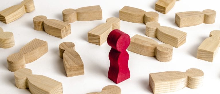 Church Members we could do without - Red block standing with wooden blocks fallen flat