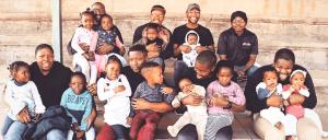 Black Fatherhood in action - group photo of black fathers with their kids