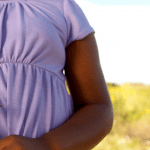 child marriage in zimbabwe - girl with sad flower