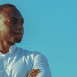 Our Youth can lead - Young African man looking into a blue sky