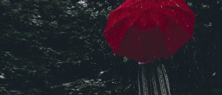 Secure in the Storm - red umbrella