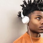 How to Parent Teens in Lockdown - image of African teenage boy with white headphones on