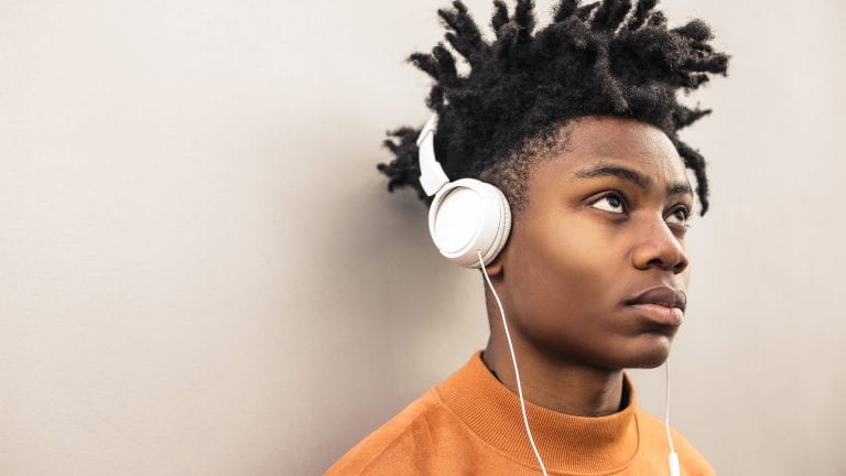 How to Parent Teens in Lockdown - image of African teenage boy with white headphones on