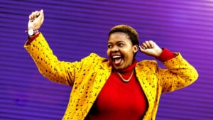 Wrestling with Biblical Womanhood - African woman partying on a bright purple background