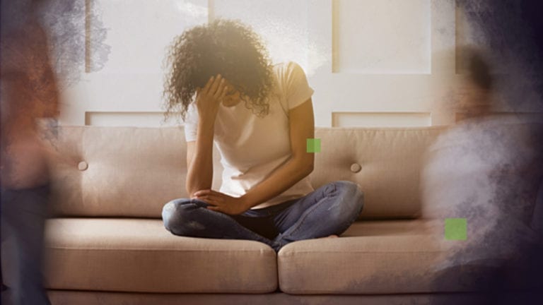 Loving God in the midst of disappointments - African woman on couch with head in hands