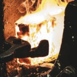 A block of white hot metal being shaped in a furnace - a crisis will shape your faith