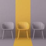 Christianity and the pursuit of tolerance - only one yellow chair in a row of grey ones
