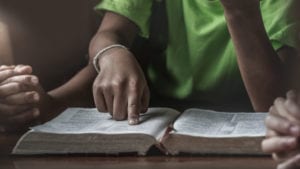 African man preparing for a sermon - is it the most important sermon he will ever preach?