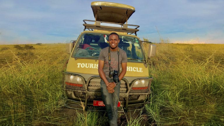 Expository preaching is like being a local in a tourist attraction - Ugandan tourist guide leaning on his vehicle in the veld