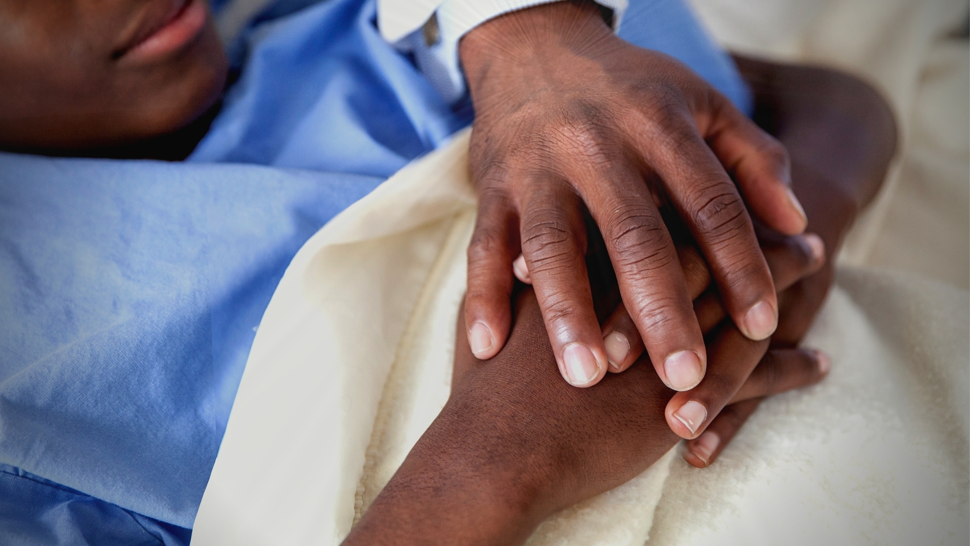 Do I need Angels to receive blessings? African man in hospital with a powerful hand over him, blessing him