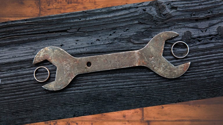 Married sex: Normal challenges and how to handle them - two wedding rings and a spanner between them