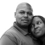 Gender roles in marriage - Aouth African couple embracing looking calm and happy