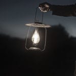 Spiritual Powers, witchcraft and christianity in Africa - a man holding a lantern in the darkness