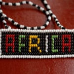 African culture & genuine evangelism - Beaded Africa on a dark red surface