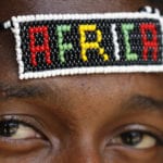 Why Isn't African Christianity impacting African Society? African man with beaded Africa headband