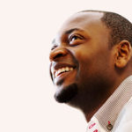 Excellent Deacons and their rewards - African man looking up and smiling