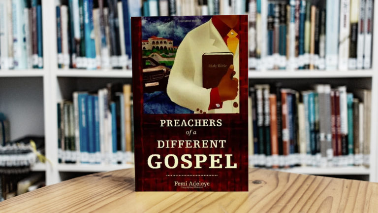 Prosperity Gospel - Book standing on a table table with many other books on shelves in the background.