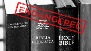 Hewbrew and Greek languages being endangered in Africa - Hebrew and Greek books next to each other with an endangered stamp on