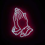 Being faithful in prayer - praying hands with a glowing outline on a dark background