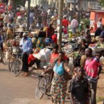 Preaching to the poor - A busy road in a township filled with people