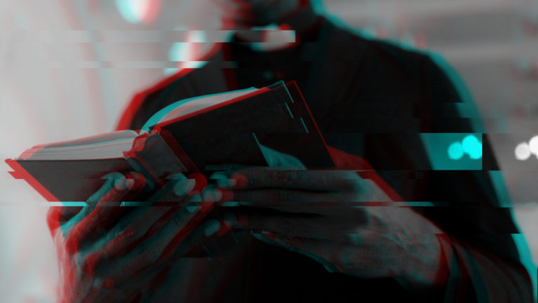 False Teaching - A person holding a book open in his hands, reading