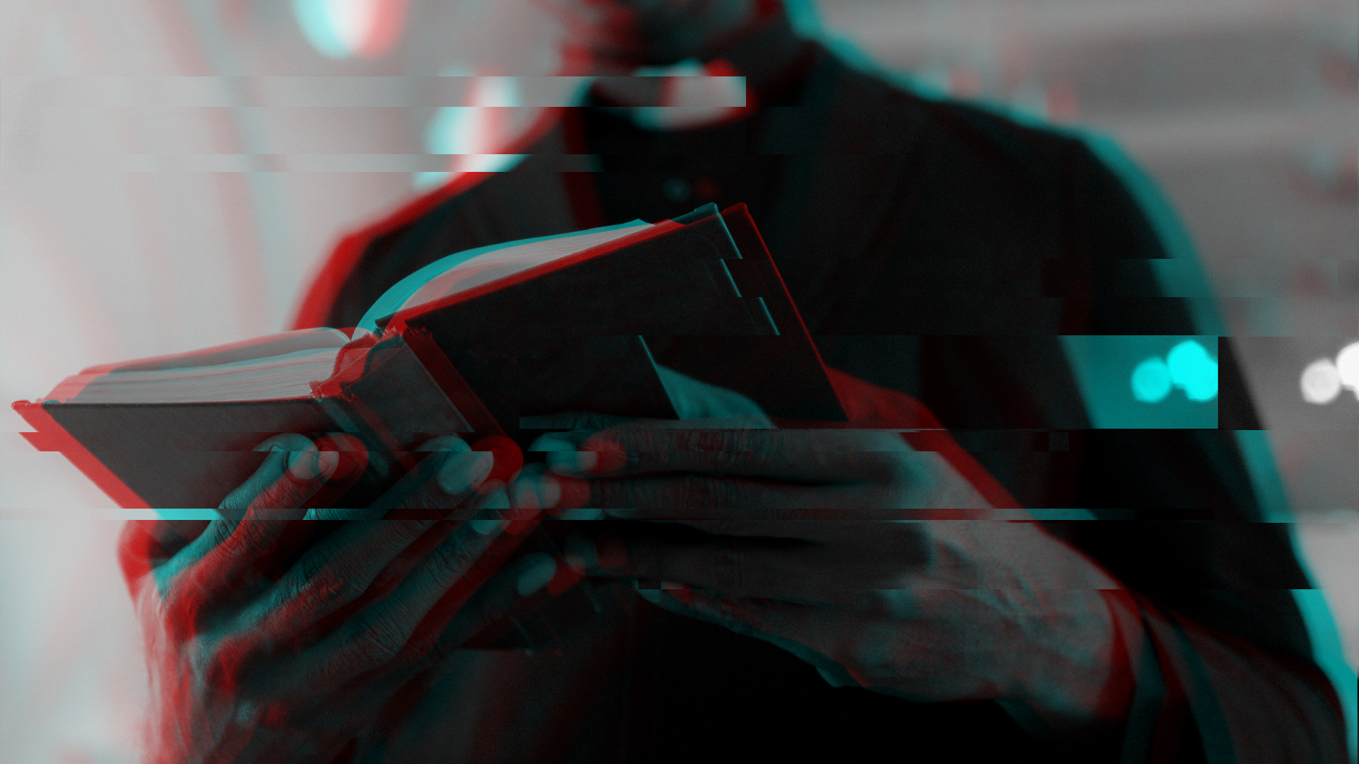 False Teaching - A person holding a book open in his hands, reading