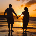 The bible on women - A couple holding hands on the beach