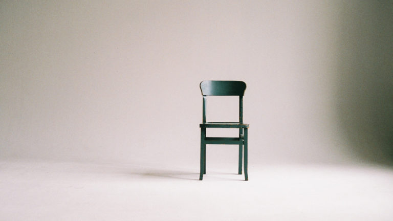 Minimalism - A chair standing in an empty room