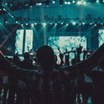 Miracles and discernment - People standing in church with hands raised