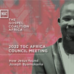 About Joseph Byamukama - A photo of a man with a red background
