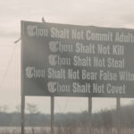 Old Testament law and The Christian - A road sign with some of ten commandments written on it