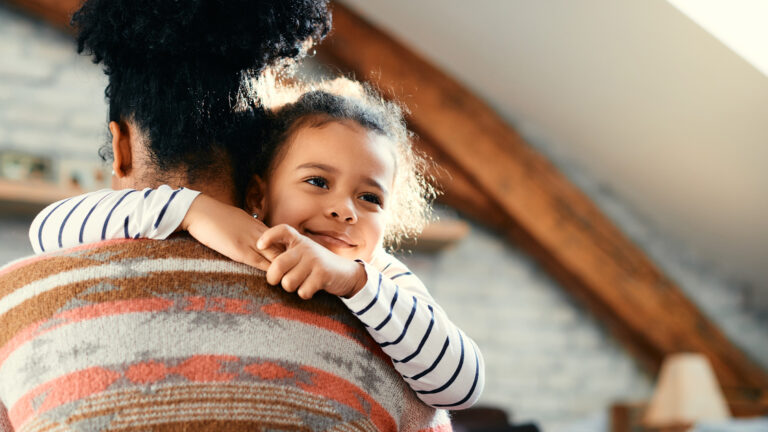 Sacrificial motherhood - A woman holding her daughter