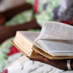 Preaching in the church - A lady paging a bible