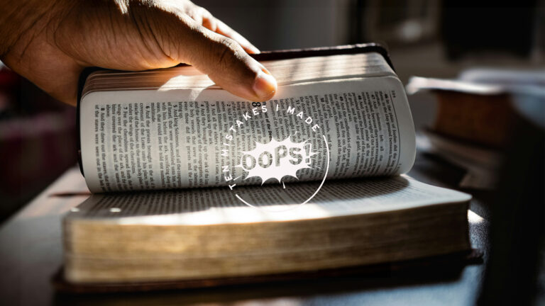 Reading the bible – A person opening up a bible to read it.