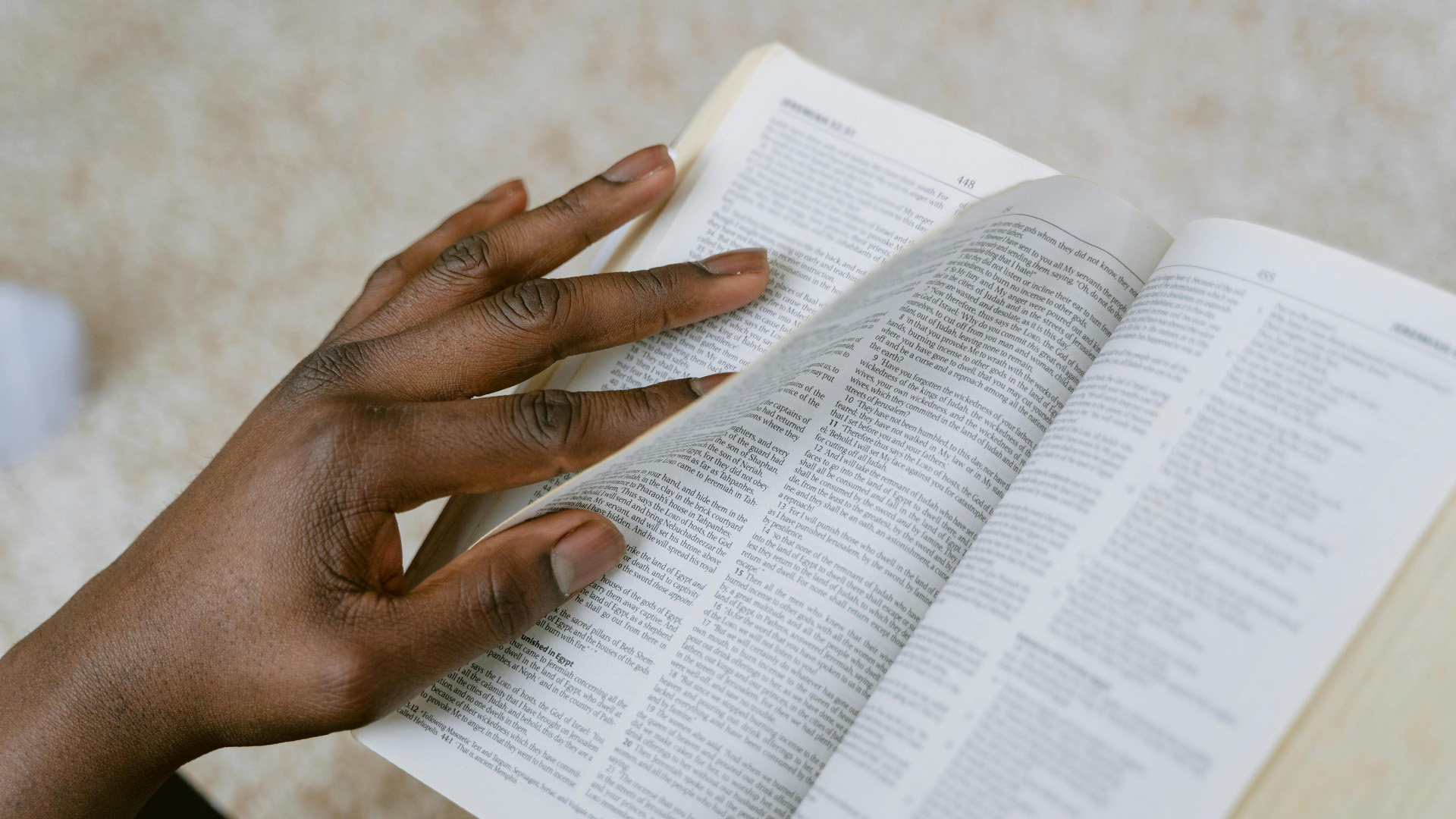 Lament and Scripture – A woman paging through the bible