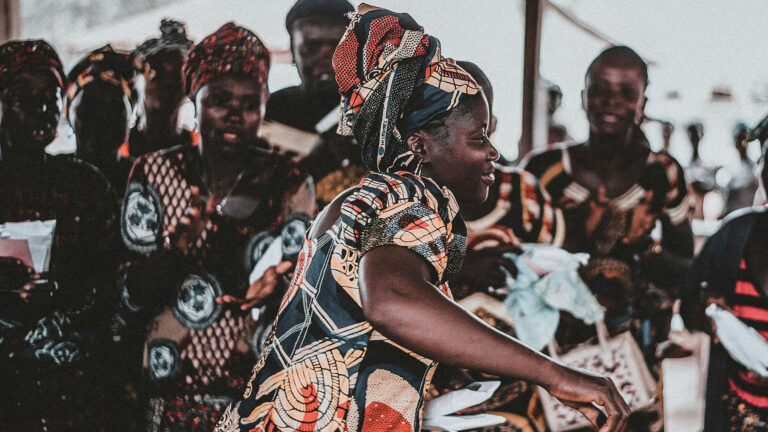 Dance in Worship – A woman dancing amongst other women