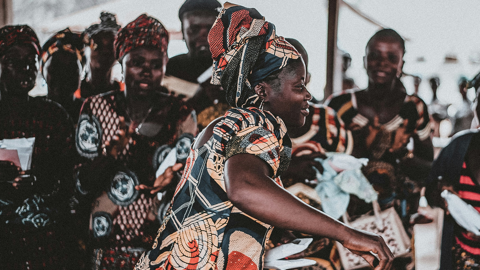 Dance in Worship – A woman dancing amongst other women